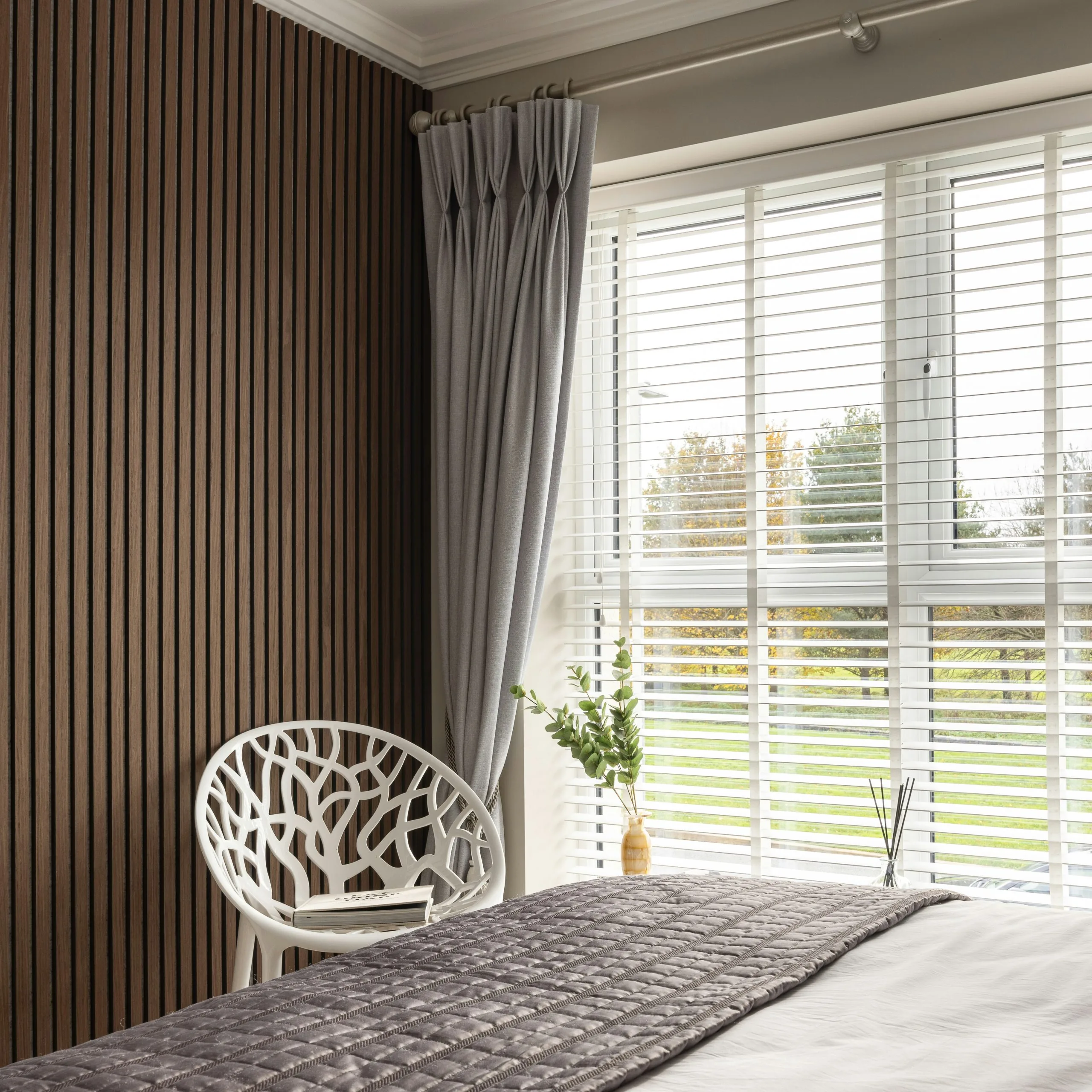Bedroom with Bed and Chair - Photo by Tile Merchant Ireland on Unsplash