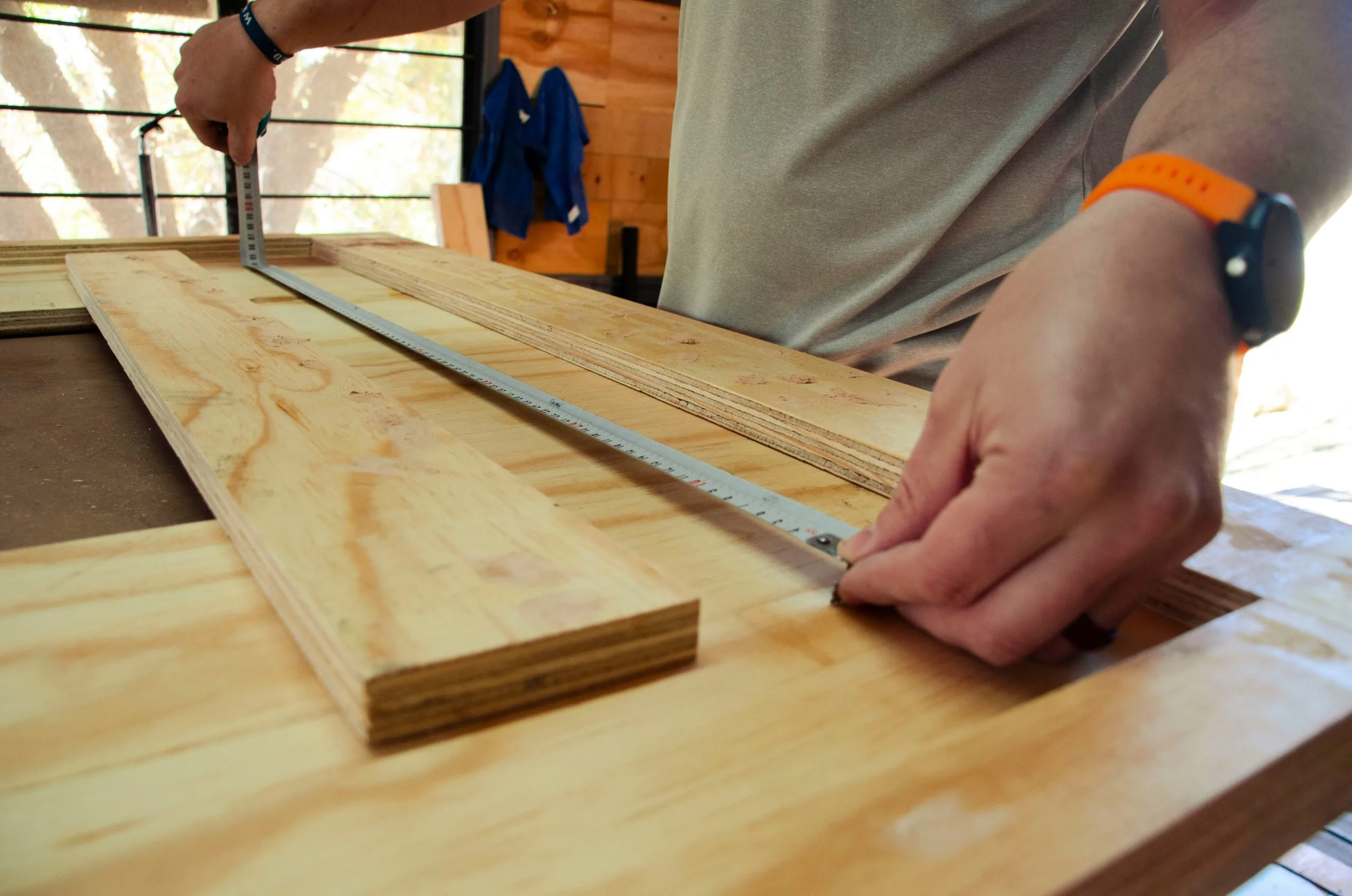 Person holding wooden table - Photo by Ryno Marais on Unsplash